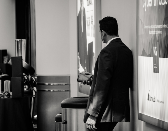 Large canva   man in suit jacket near poster  1 