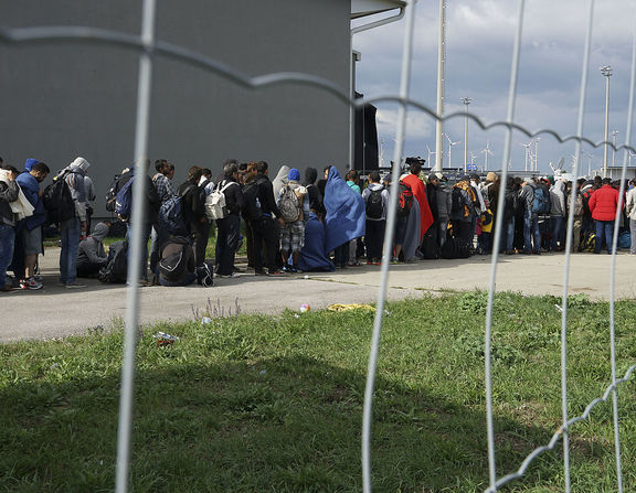 Large 1200px a line of syrian refugees crossing the border of hungary and austria on their way to germany. hungary  central europe  6 september 2015