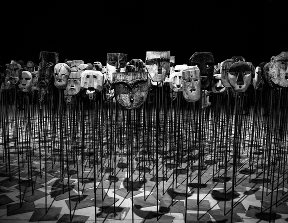 Large canva   greyscale photo of masks on a stick