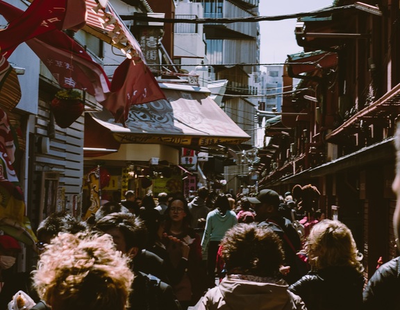 Large canva   urban photo of a crowd in a marketplace