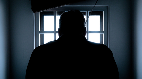 Homepage canva   rear view of a silhouette man in window
